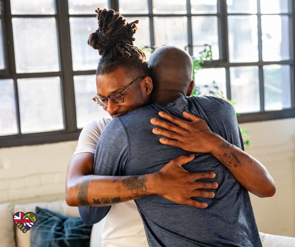 2 men hugging after talking about their problems together and supporting each other.