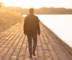 Man walking towards a new beginning, representing support for veterans leaving prison in the UK.